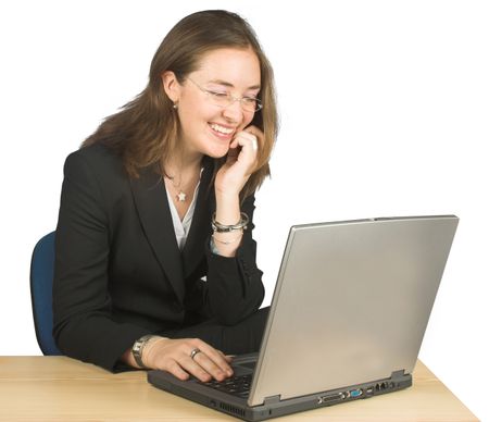 business woman laughing whilst using her laptop