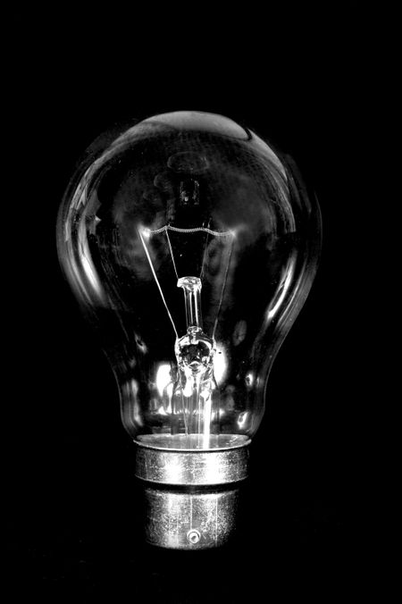 clear bulb over a black background