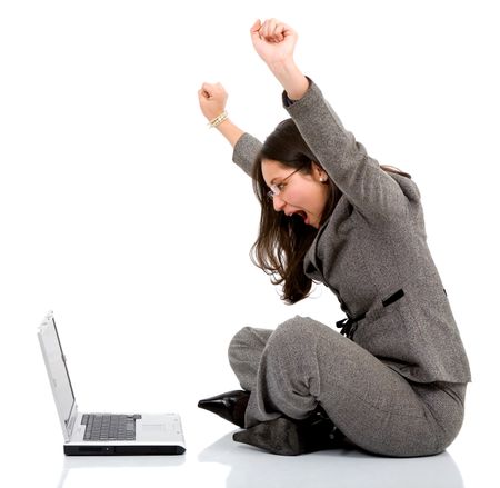business woman happy with her success while working on a laptop - isolated over a white background