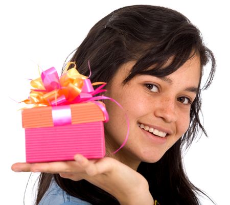 casual girl holding a gift smiling over a white background