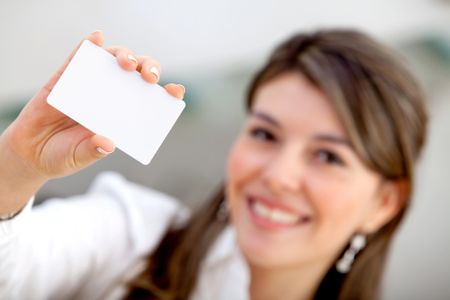 Woman displaying a personal business card at the office