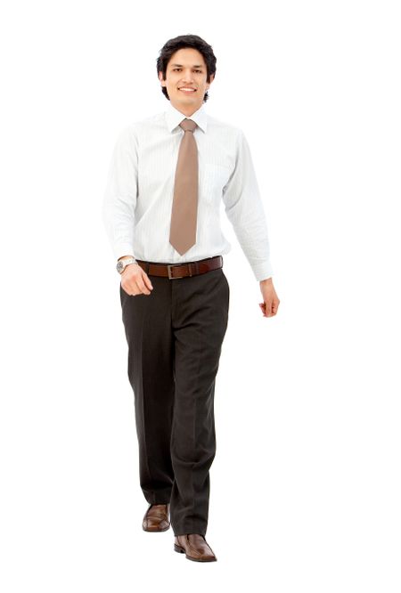 Business man walking towards the camera - isolated over white