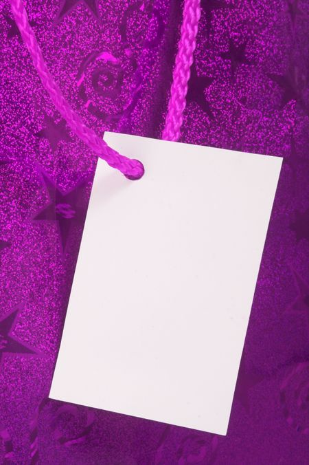 purple tag on present - blank for you to write or place a photo