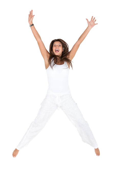 Excited woman jumping and wearing white clothes - isolated