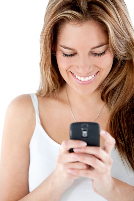 Woman texting on her cell - isolated over a white background