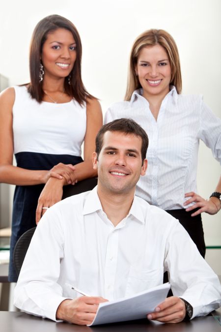 Small group of business people at the office smiling