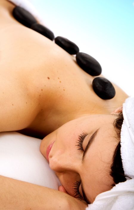 Beauty and Spa - Girl with zen stones on her back