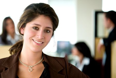 business woman portrait leading her team in an office environment