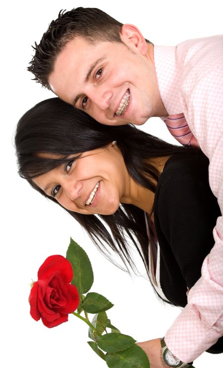 happy couple with rose over a white background where the guy has braces