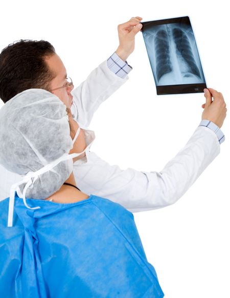 doctors analyzing an xray over a white background