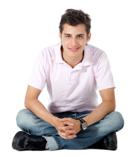 Casual man sitting on the floor - isolated over a white background