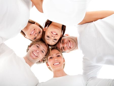 Group of friends hugging in a circle - isolated over a white background