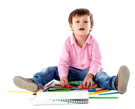 Beautiful kid on the floor with color pencils - isolated over a white background