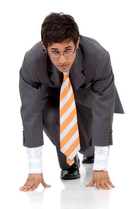 Business man ready to race against the competition isolated over a white background