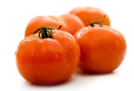 four red tomatoes isolated over a white background