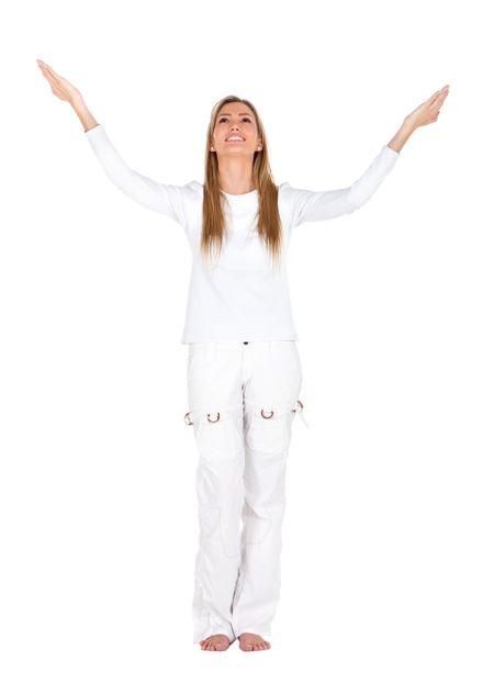 Excited fullbody woman in white with arms opened - isolated
