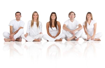 Happy group of friends sitting on the floor - isolated over a white background