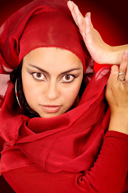 beautiful arabic belly dancer over a red background