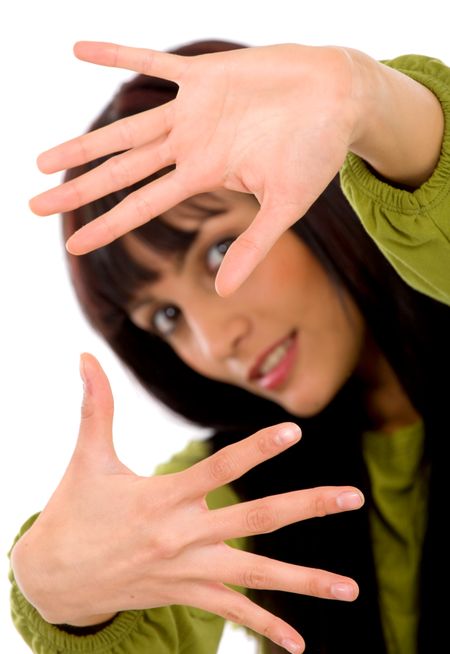 Beautiful girl framing the photo isolated over a white background