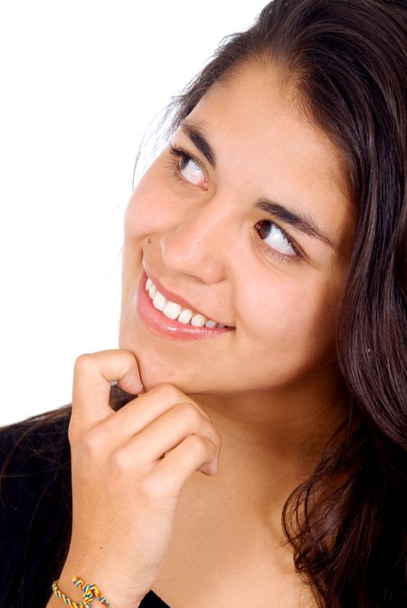 girl dreaming away and smiling isolated over a white background
