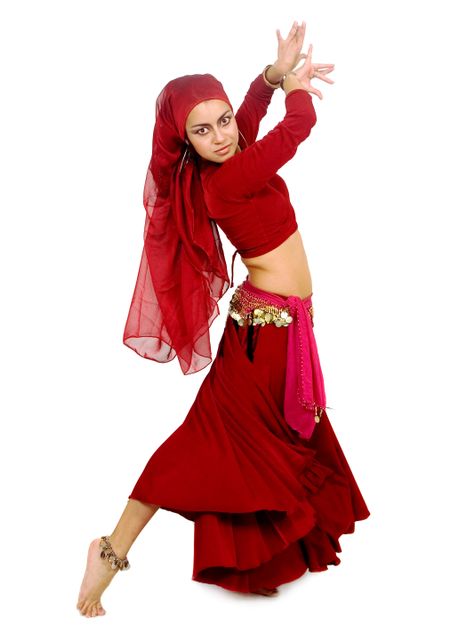 beautiful arabic belly dancer in red isolated over a white background