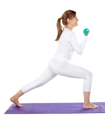 Beautiful woman exercising isolated over a white background