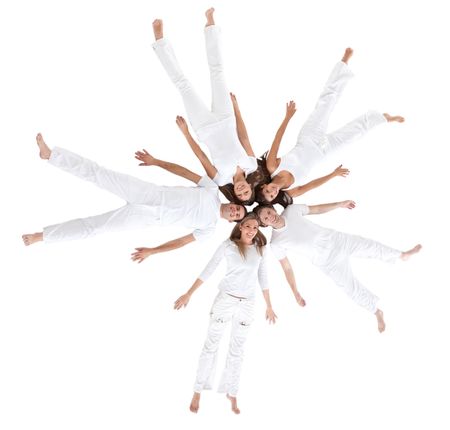 People lying on the floor making a circle and wearing white clothes - isolated