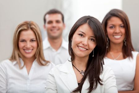 Group of business people at the office smiling