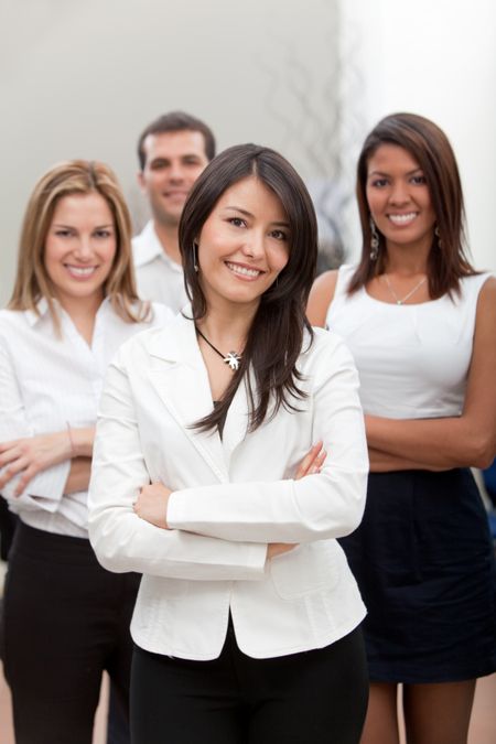 Group of business people at the office smiling