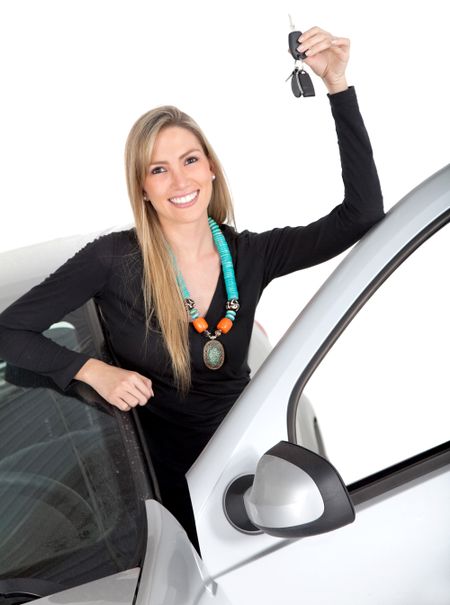 Happy woman with a car holding the keys ? isolated over a white background