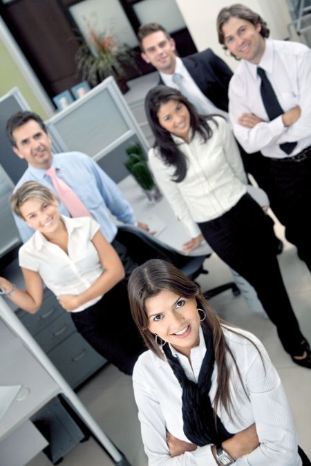 Group of business people at the office smiling