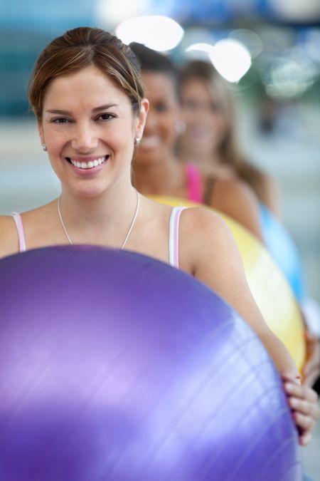 Group of women in a pilates class at the gym