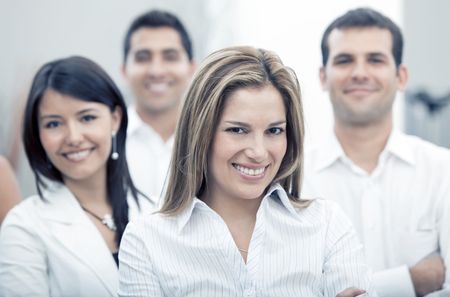 Group of business people at the office smiling