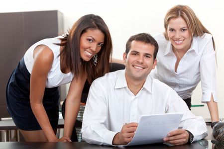 Business man with his female assistants at the office