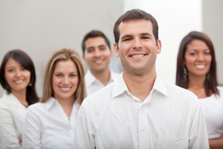 Group of business people at the office smiling