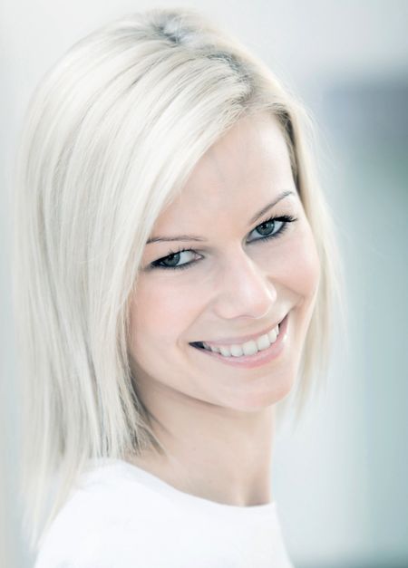 Portrait of a beautiful woman smiling indoors