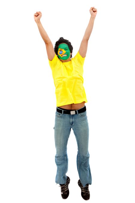 Excited man with the Brazilian flag painted on his face