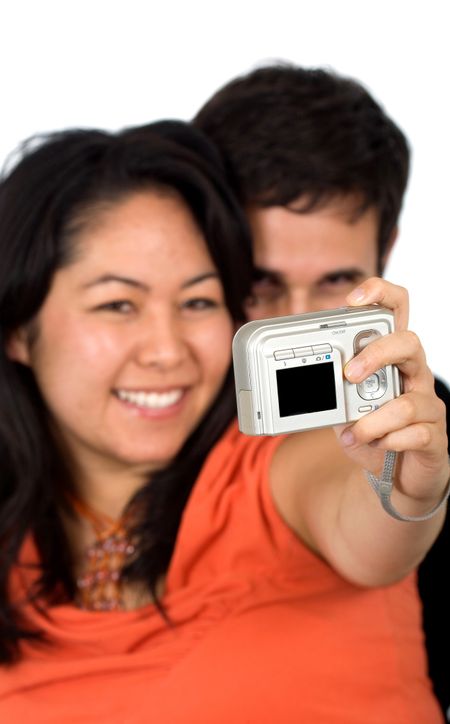 couple taking a self portrait - over a white background