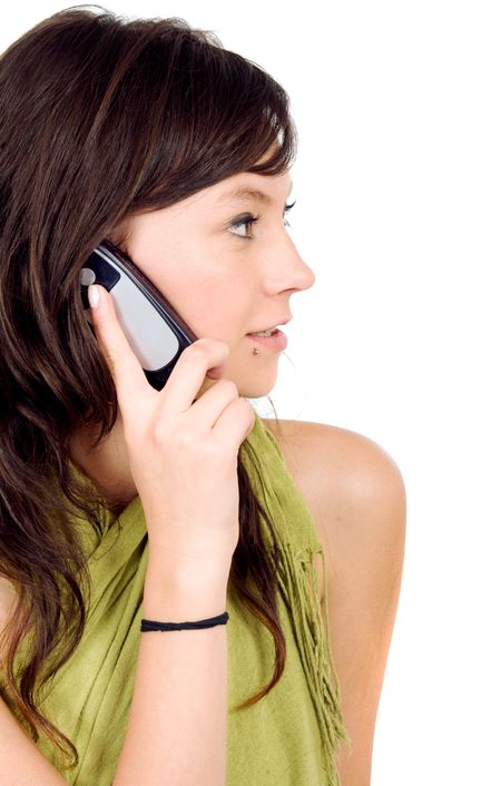 casual girl on the phone isolated over a white background
