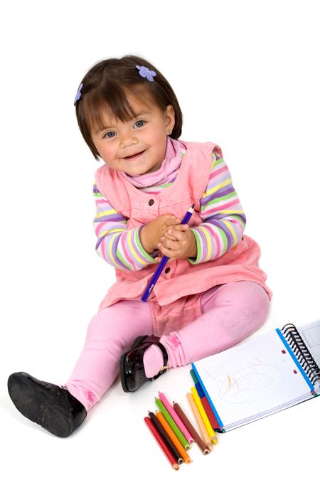 girl colouring on a notebook isolated over a white background