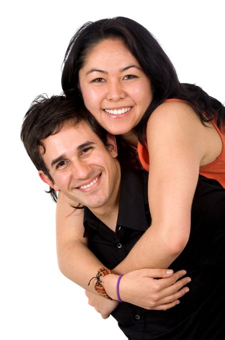 young couple smiling and standing next to each other - isolated over a white background