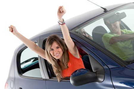 Woman coming out from the window of a car - isolated over a white background
