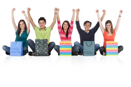 Happy group of shopping people - isolated over a white background