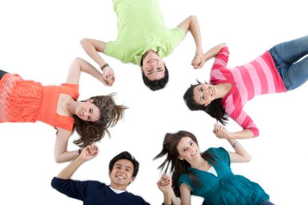 Group of friends lying on the floor making a circle - isolated over a white background
