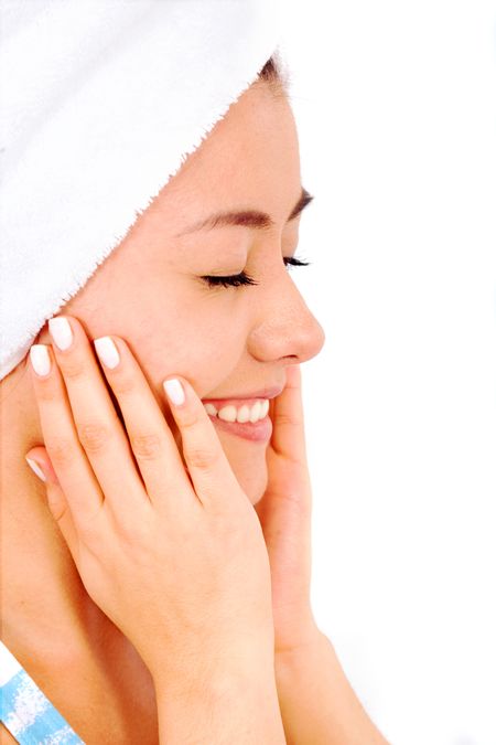 beauty and spa portrait of a very healthy looking girl isolated over a white background