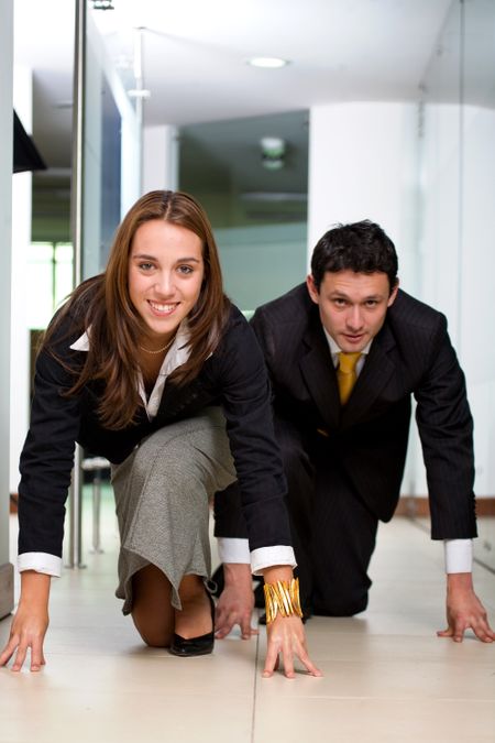 business competition in an office environment between a businessman and a businesswoman