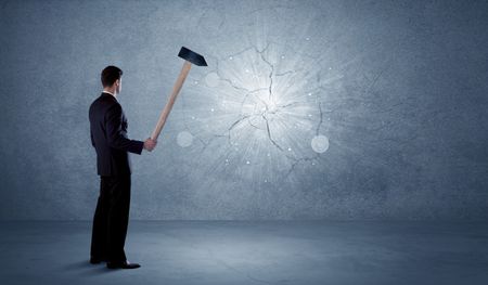 business-man-hitting-grungy-wall-hammer-577239331 Business man hitting grungy wall with a hammer