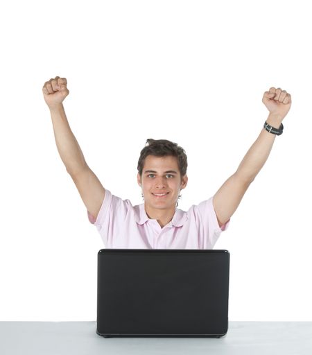 Happy man working on a laptop with arms up - isolated over white