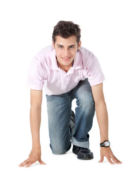 Man getting set into a position for running - isolated over white