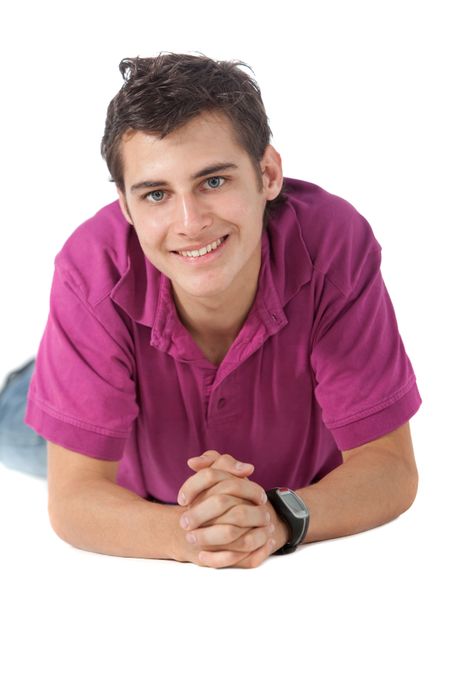 Casual man lying on the floor and smiling - isolated over a white background